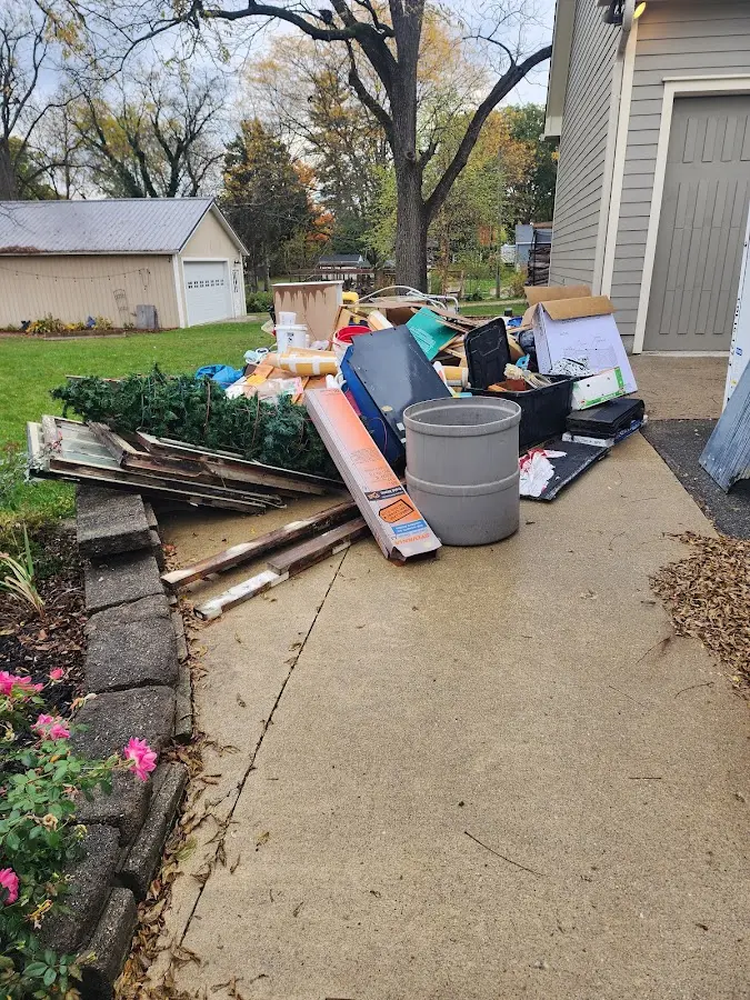 Dumpster being loaded with debris for Commercial Dumpster Rental in Boonton